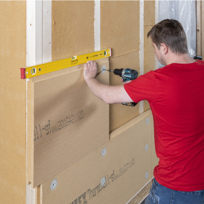 Poser la deuxième rangée d'Isolation en fibres de bois